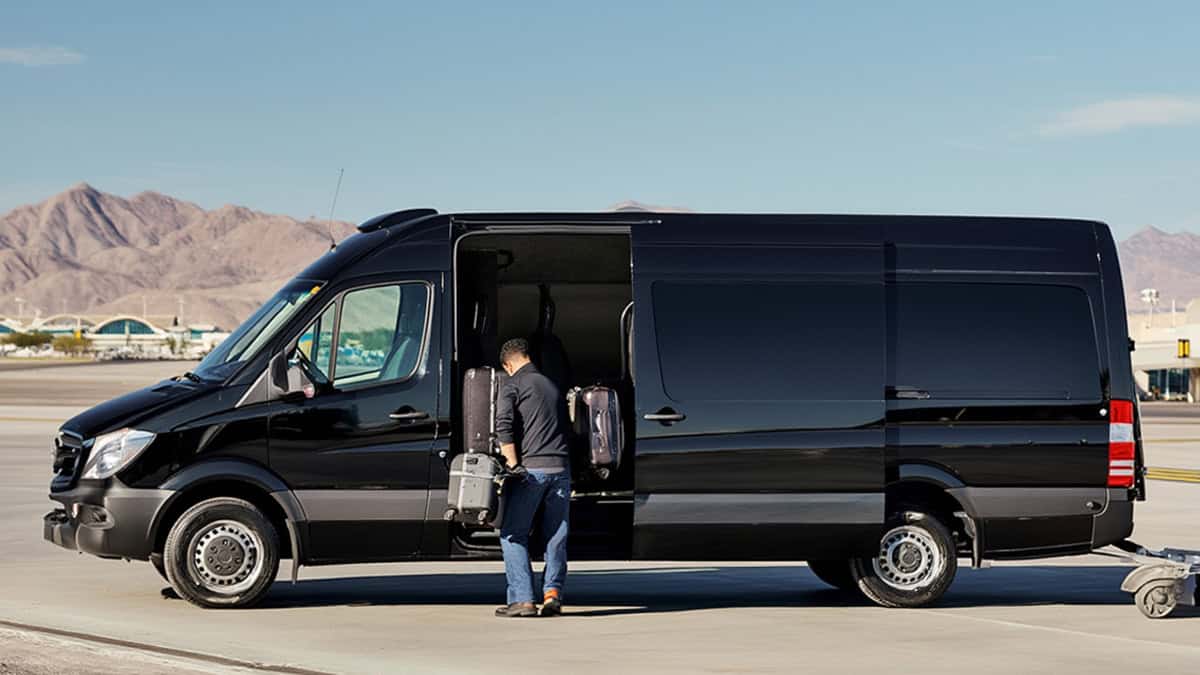 Black Sprinter Van Airport Shuttle With Luggage Loading