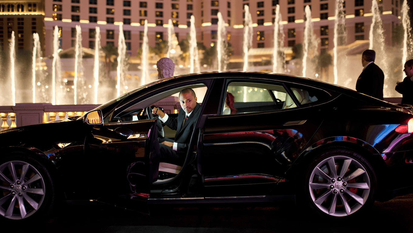 Tesla Model S sedan at the Bellagio fountains in Las Vegas - Personal Sedan Services