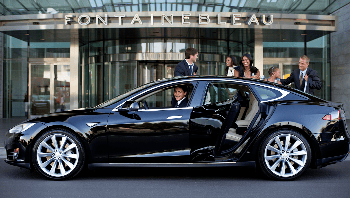 Professional chauffeur with a Tesla Model S sedan at the Fontainebleau in Las Vegas - Personal Sedan Services