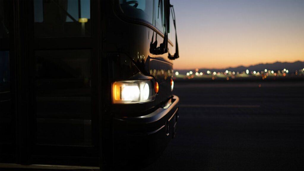 Black Shuttle At Dawn With Headlights