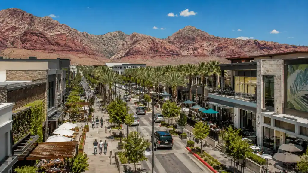 Downtown Summerlin open-air shopping and dining district with pedestrian streets and red rock mountains behind it, a top thing to do in Summerlin Las Vegas