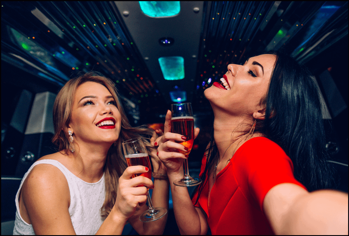 Group celebrating aboard a Las Vegas party bus rental - Personal Sedan Services
