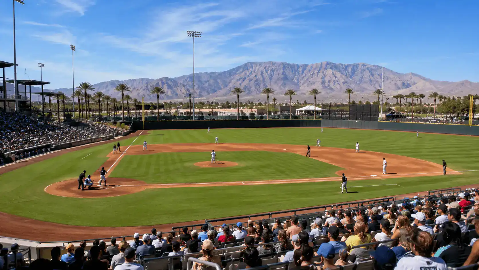 Las Vegas Ballpark Aviators Baseball Game Summerlin Downtown Stadium Crowd – Personal Sedan Services A minor-league baseball game at the Las Vegas Ballpark in Downtown Summerlin with a crowd, green field, and desert mountains beyond the outfield