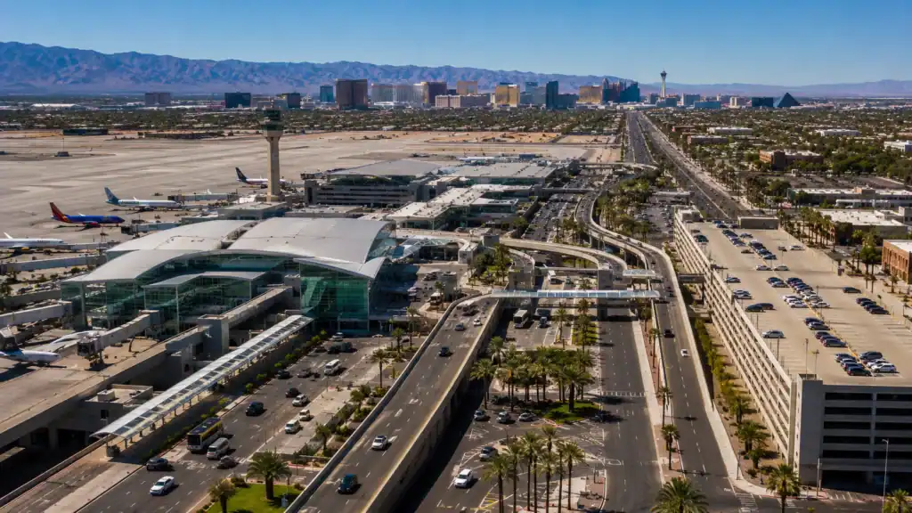 Aerial daytime view of Harry Reid International Airport Las Vegas with the Strip visible 3 miles to the north showing the airport-to-Strip transportation corridor that Las Vegas transportation statistics describe