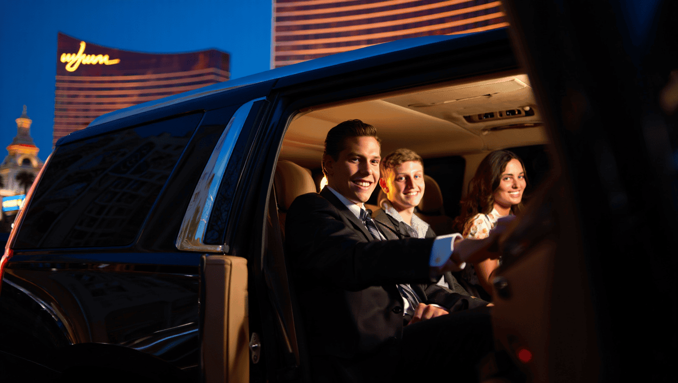 Chauffeured black Cadillac Escalade SUV dropping guests off at the Wynn Las Vegas - Personal Sedan Services