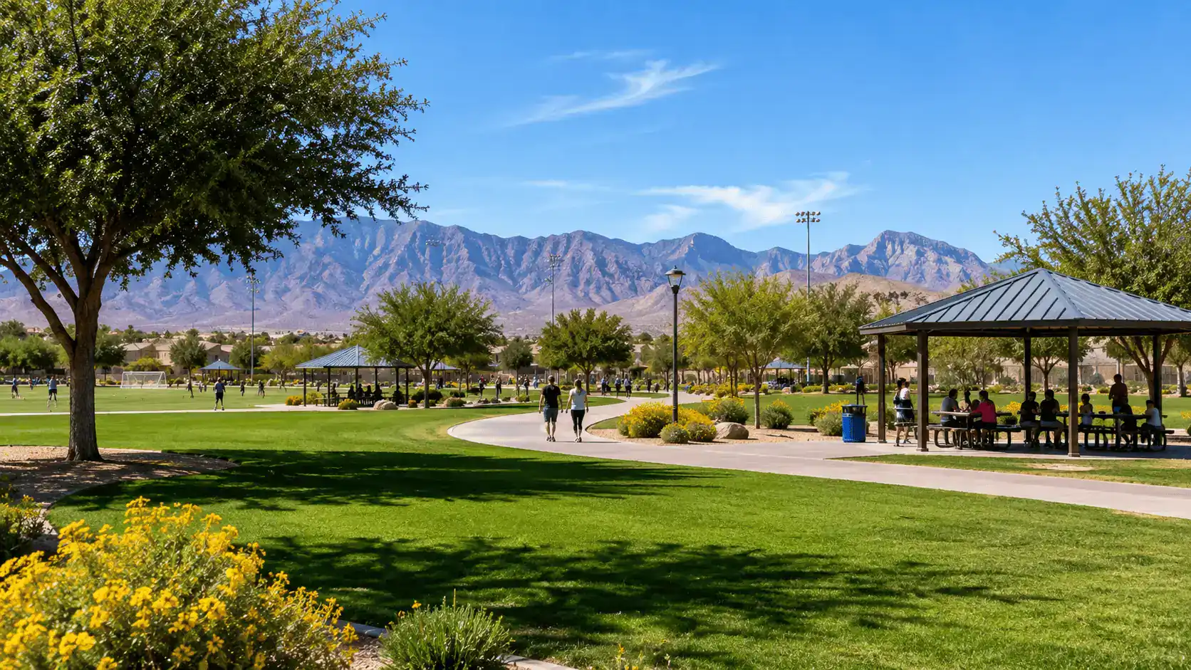 Whitney Ranch Park Community Recreation East Las Vegas Nevada Sports Fields – Personal Sedan Services A well-kept community park in Whitney Nevada with green sports fields, walking paths and picnic areas with desert mountains in the background