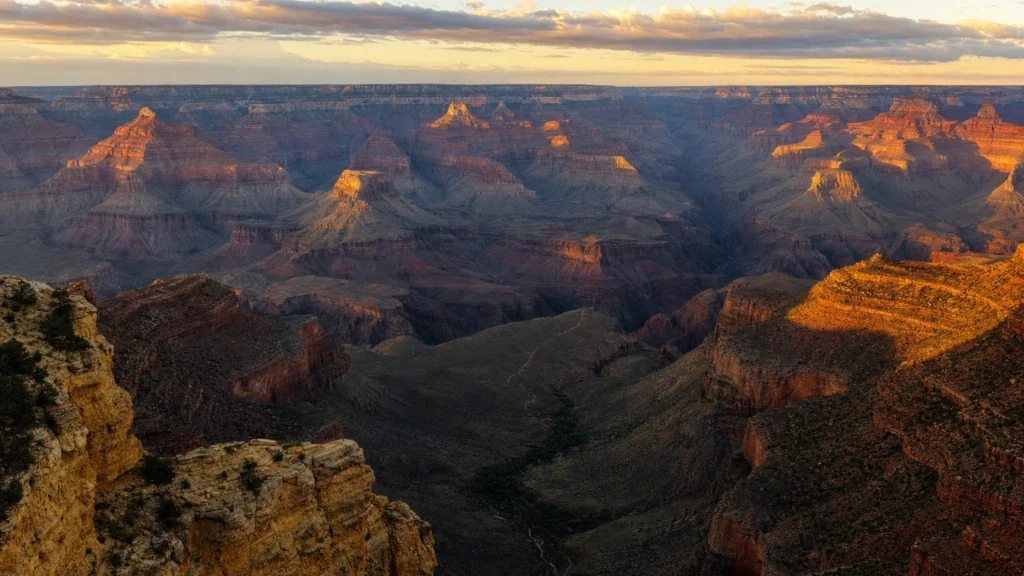 Grand Canyon South Rim buttes glowing at golden hour, the best time to visit the canyon