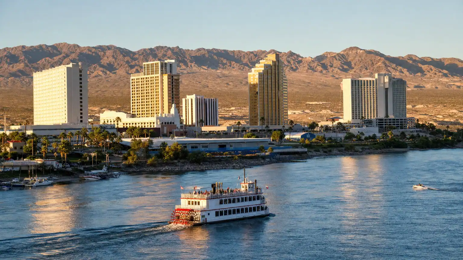 Laughlin Nevada casino resort towers along the Colorado River at golden hour