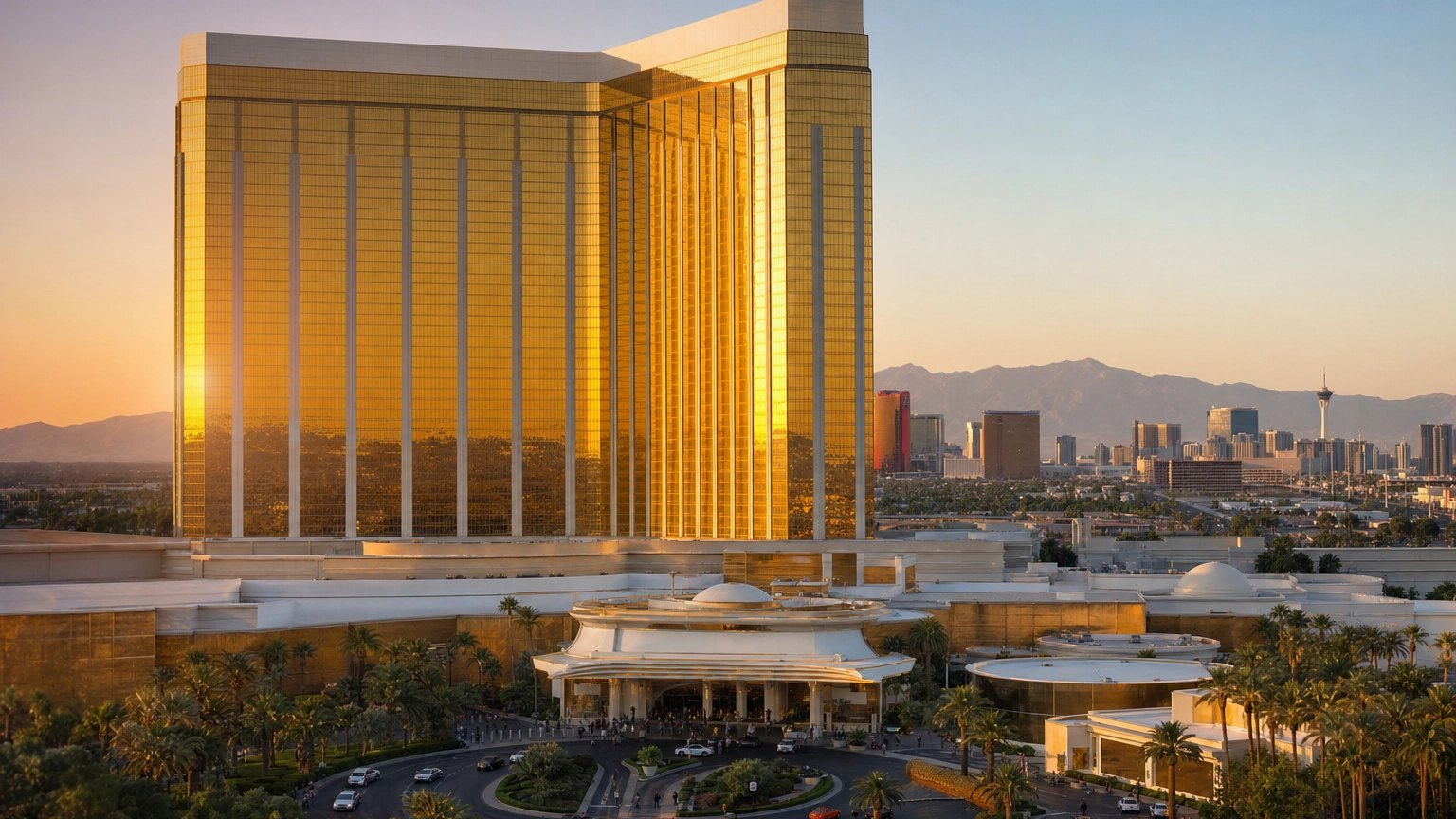 Mandalay Bay Resort Gold Tower On The South Strip – Personal Sedan Services Large gold-glass resort tower anchoring the south end of the Las Vegas Strip at dusk near the airport