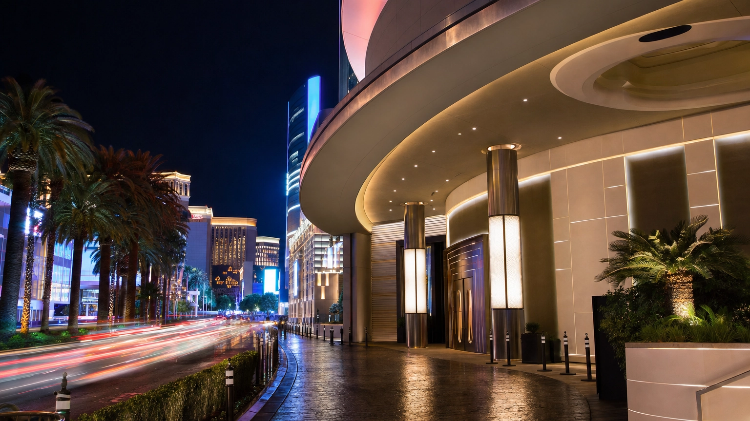 Las Vegas nightlife venue exterior directly on the Strip with neon signage and car light trails at night, in the style of Peppermint Hippo