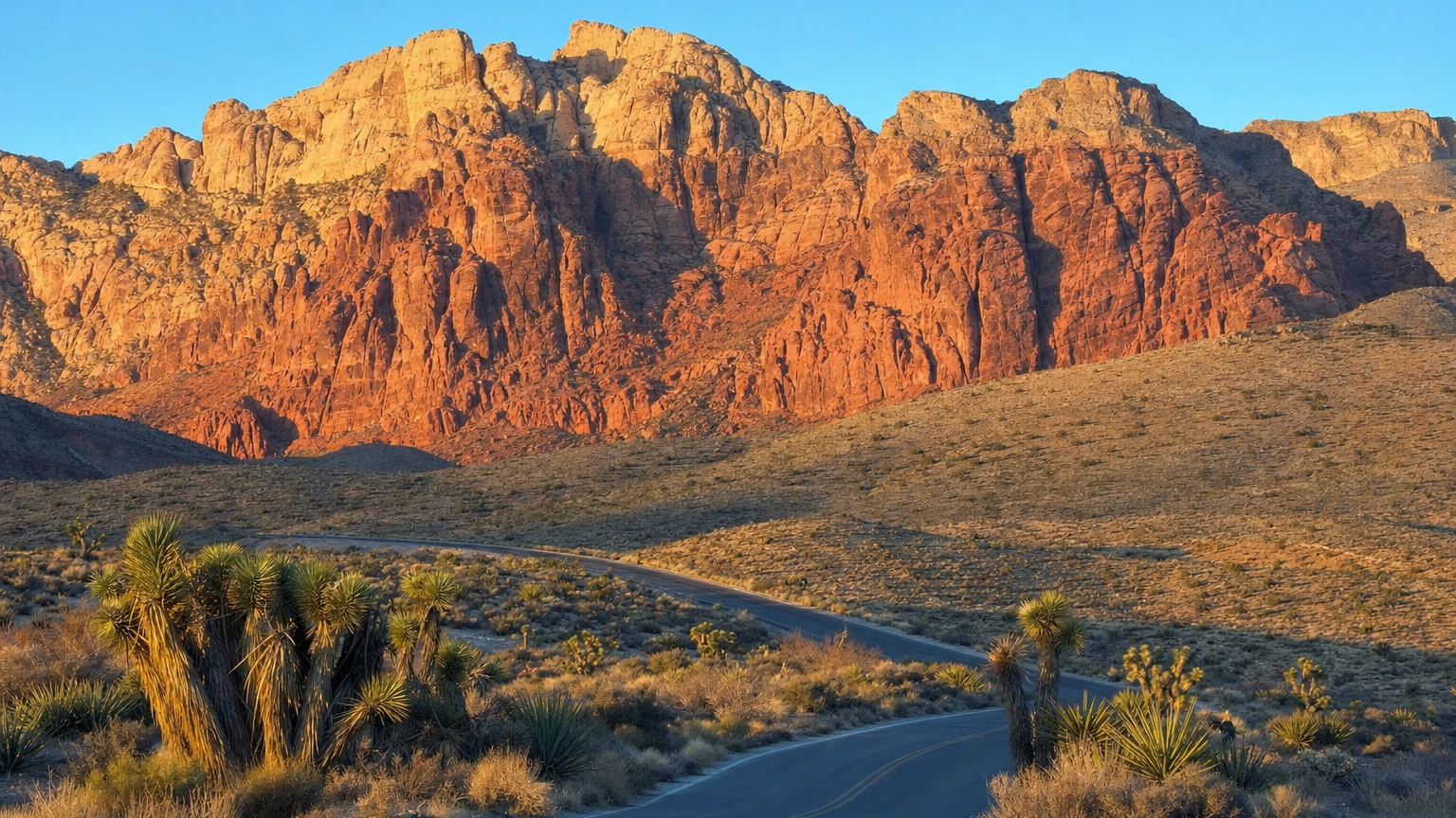 Red Rock Canyon Scenic Drive Near Las Vegas – Personal Sedan Services Red and cream sandstone cliffs above the scenic drive at Red Rock Canyon, 17 miles west of the Las Vegas Strip