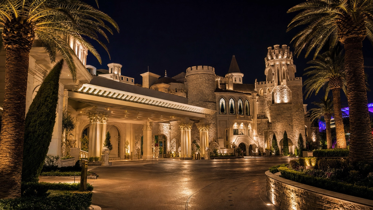 Opulent villa-and-castle-style Las Vegas venue exterior with warm uplighting and a grand entrance at night, in the style of Treasures